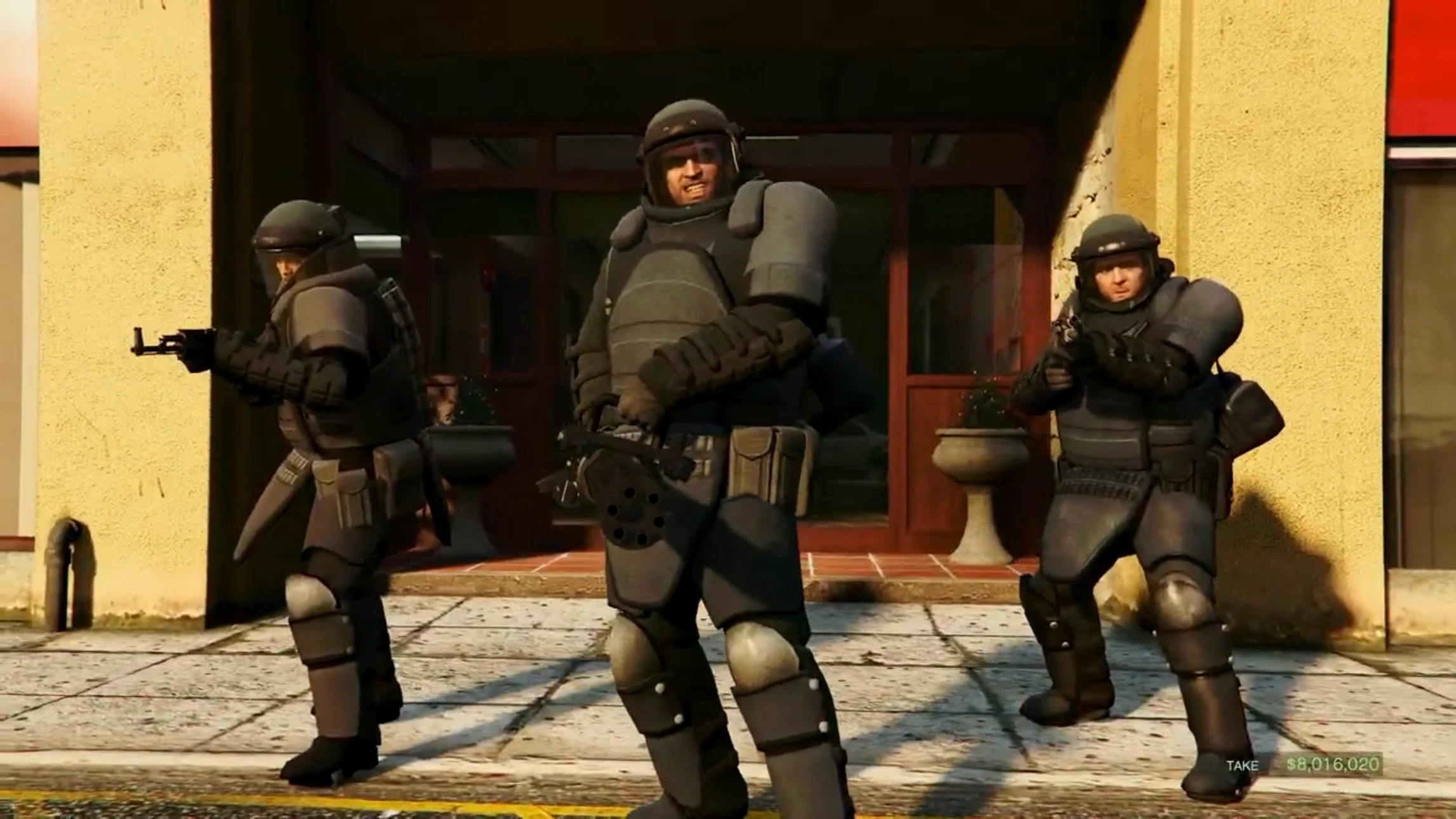 Trevor with a mini gun, smiling.